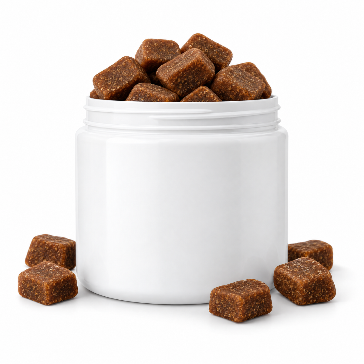Plain white jar overflowing with soft chews, white background.